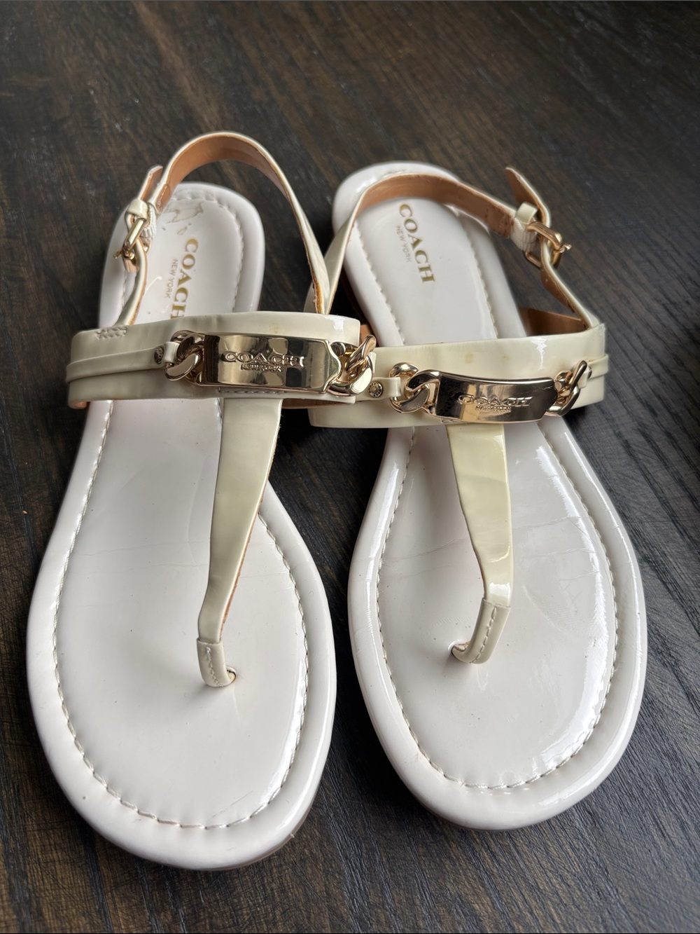 Coach Catherine flat sandals, cream patent leather, hold tone hardware, size 7